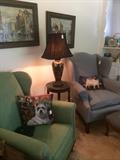 Two of the assorted chairs & decorative pillows; one of many lamps