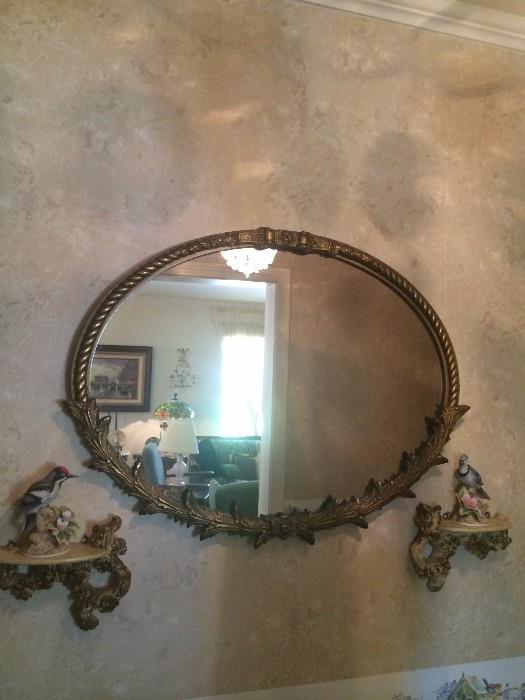 One of several antique mirrors; wall shelves with bird figurines