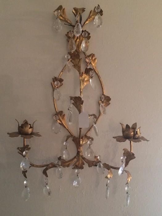 One of two antique wall sconces