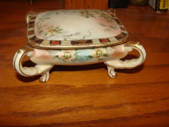 Very lovely and unusual porcelain lidded and footed jewelry box
