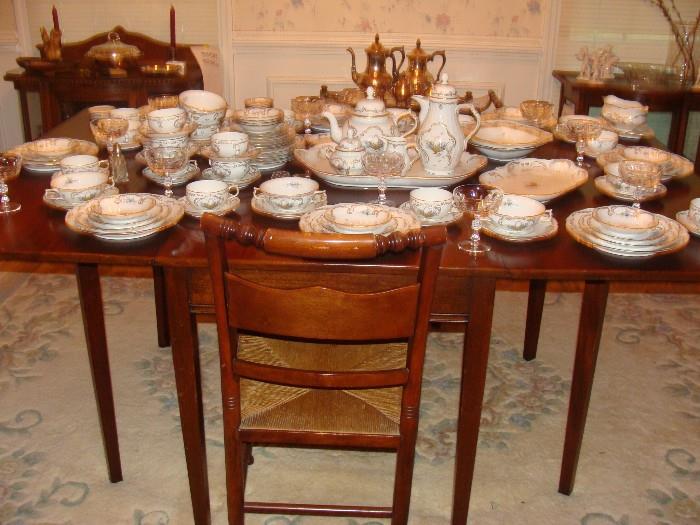 Beautiful Dining Table with 6 matching rush seated Chairs and China Hutch