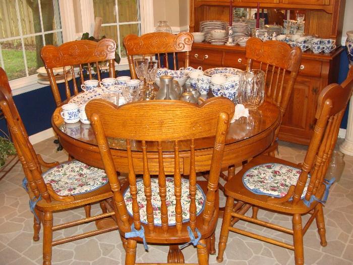 Gorgeous Round Oak Table with 2 Leaves, 6 matching Press Back Chairs and Oak China Hutch