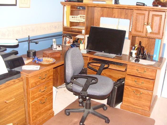 "L" - Shaped Office Desk with Hutch, Office Chair, HP Pavilion Computer with Windows Vista and 22" Monitor lots of Discs including JANES military, and many more!