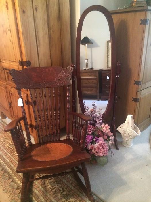 Antique rocker and oval floor mirror