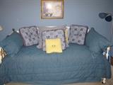 Iron daybed with denim bedding