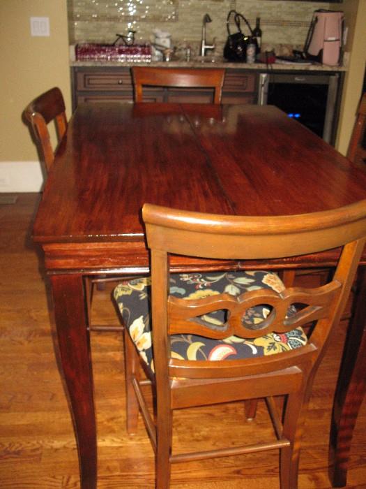 30" high gathering table with chairs - has a leaf inside.