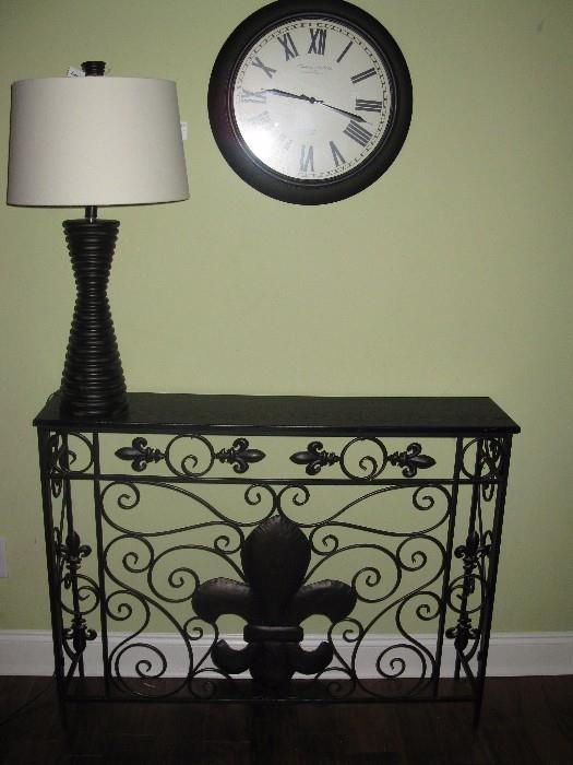 Metal console table measures about 45" long, 34" high, 10" deep