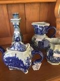 Various pitcher, teapots, and candle holders in blue & white