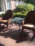 Wicker patio rockers; one of two glass top tables