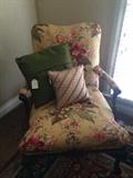 Floral arm chair; decorative pillows