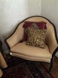Luscious gold chair with decorative pillows
