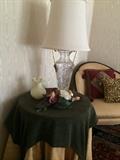 Custom cloths over small round table; one of many lamps