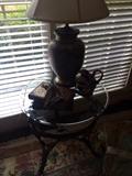 Small round glass top table with metal base