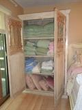 nice armoire, lots of nice linens