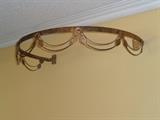 this hangs above the brass bed & holds gauzy fabric