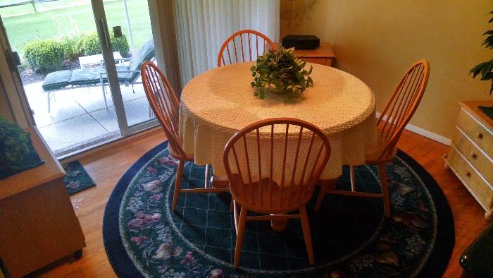 Modern Ethan Allen table, matching leaf, four chairs, and other matching pieces in the dining nook
