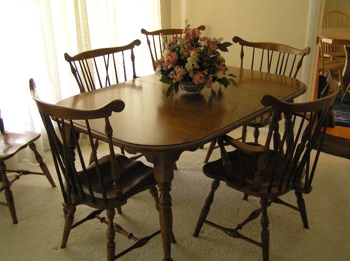 Tell City Furniture Company dining set---Table with two leaves and matching pads, Two armed Captain's chairs, Four matching side chairs ---- For those who know quality, Tell City Furniture ranks high for a Mid Western Mid-Century Colonial manufacturer