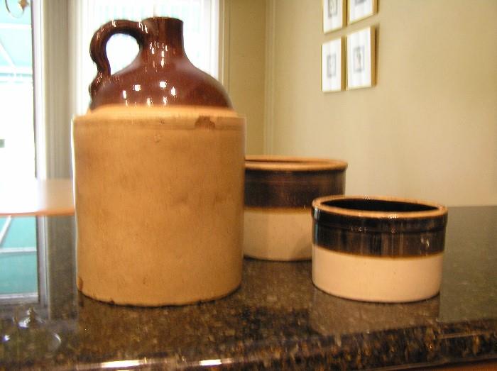 Antique and modern crocks and jug