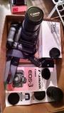 Canon EOS 3 with Speedlite flash, extra 300 mm lens, etc