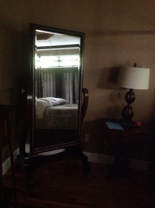 Large oversized floor mirror on matching stand and does swivel. Matches Master Bed.
