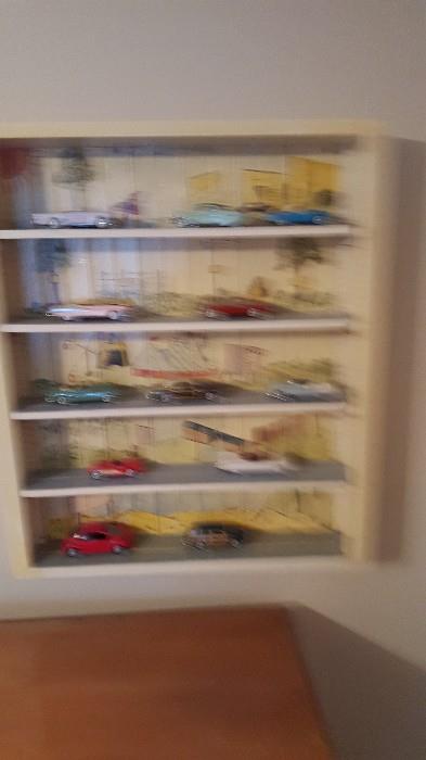 painted collectable shelf and cars