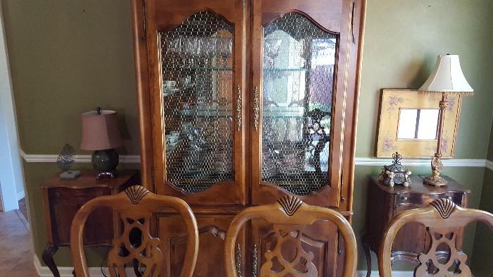 country french china cabinet and a view of three of the dining chairs