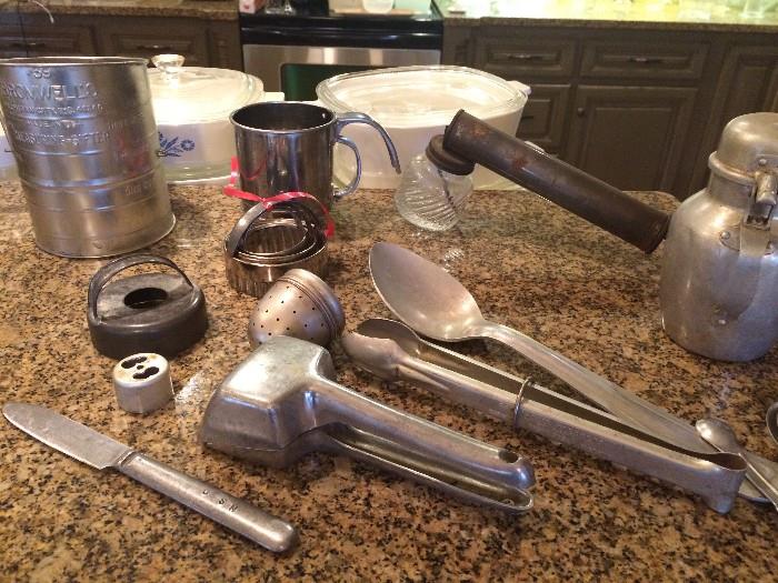 Vintage aluminum kitchen utensils and biscuit cutters