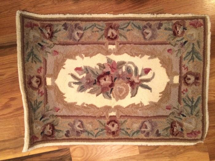 Small hooked throw rug