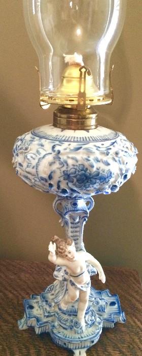 Striking porcelain cherub oil lamp