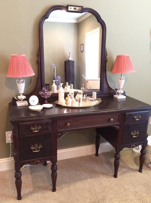 Antique vanity; porcelain vanity lamp pair; mirrored vanity tray with perfume bottles