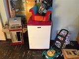 Toys from the Grand kids,,,,and a pink and white dorm fridge