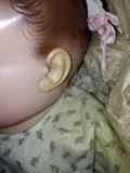 Ears are a different material from the head, doll is in very nice condition
