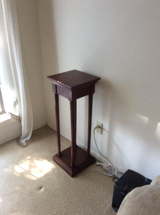Wood pedestal or plant stand. 
