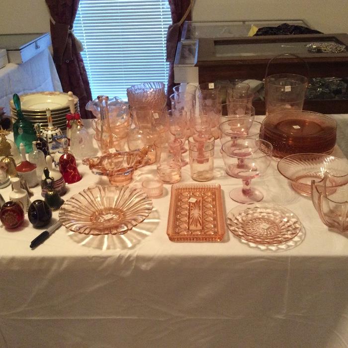 Lots of vintage pink depression glass, including some rare pieces. 