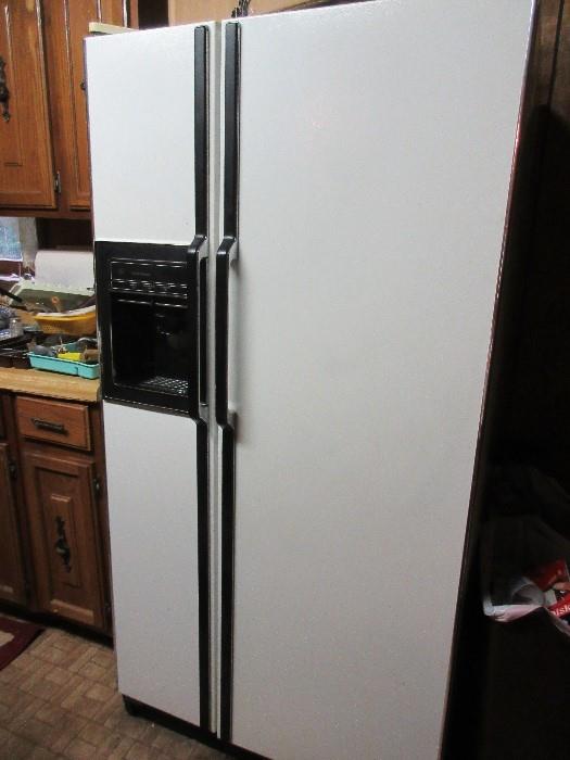 Refrigerator with French doors and in door automatic ice maker.