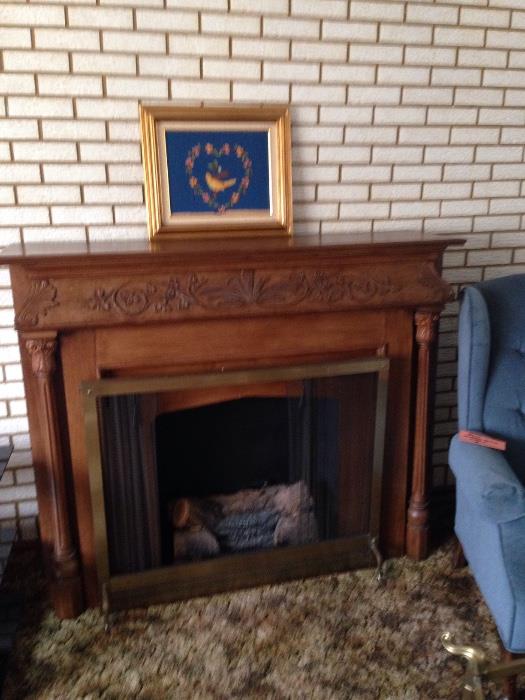 Beautiful fireplace mantle.  It has a removable decorative firewood log light (it lights up and the "flame" revolves & makes crackling sounds like a real fire!