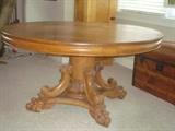 Antique Round 54" oak table with very ornate  carved legs...$1500..