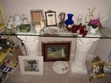 Sofa Table/glass top with 2 fluted columns..Assiorted decorator items.