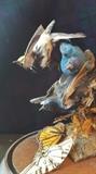 Antique Victorian four bird and three butterfly taxidermy under glass dome.
