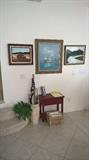 Paintings and umbrella stand