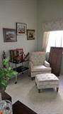 Chair with ottoman, folding bar cart, Paintings, decanters and eagle figures