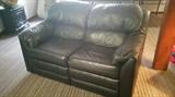 Leather reclining love seat