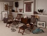 An interesting group of decorative items as well as cruise ship style deck chairs, Korean trunk, Antique Chinese washstand with mirror, African bone vest and Seed pod vest, ceramic pagoda, pair of metal pheasants, carp, Chinese headress, Guatemalan child's textile shirt, Japanese woodblock prints, Indian wedding blouse