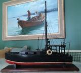 wood model of Ernest Hemmingway's boat, "Pilar" Jack L Gray painting in the background.