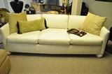Off White Upholstered Six Cushion Sofa