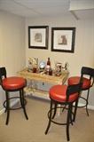 Three Black Iron and Red Leather Bar Stools