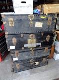 4 nice old metal trunks two with leather english saddles