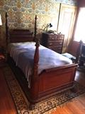 We have two beautifully carved mahogany twin beds with paw feet