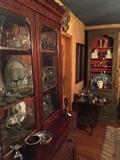 Beautiful flame mahogany secretary [front pulls out and becomes a desk].  In the background, you can see one of the tall, painted French bookcase etageres.