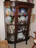very nice curved glass curio cabinet